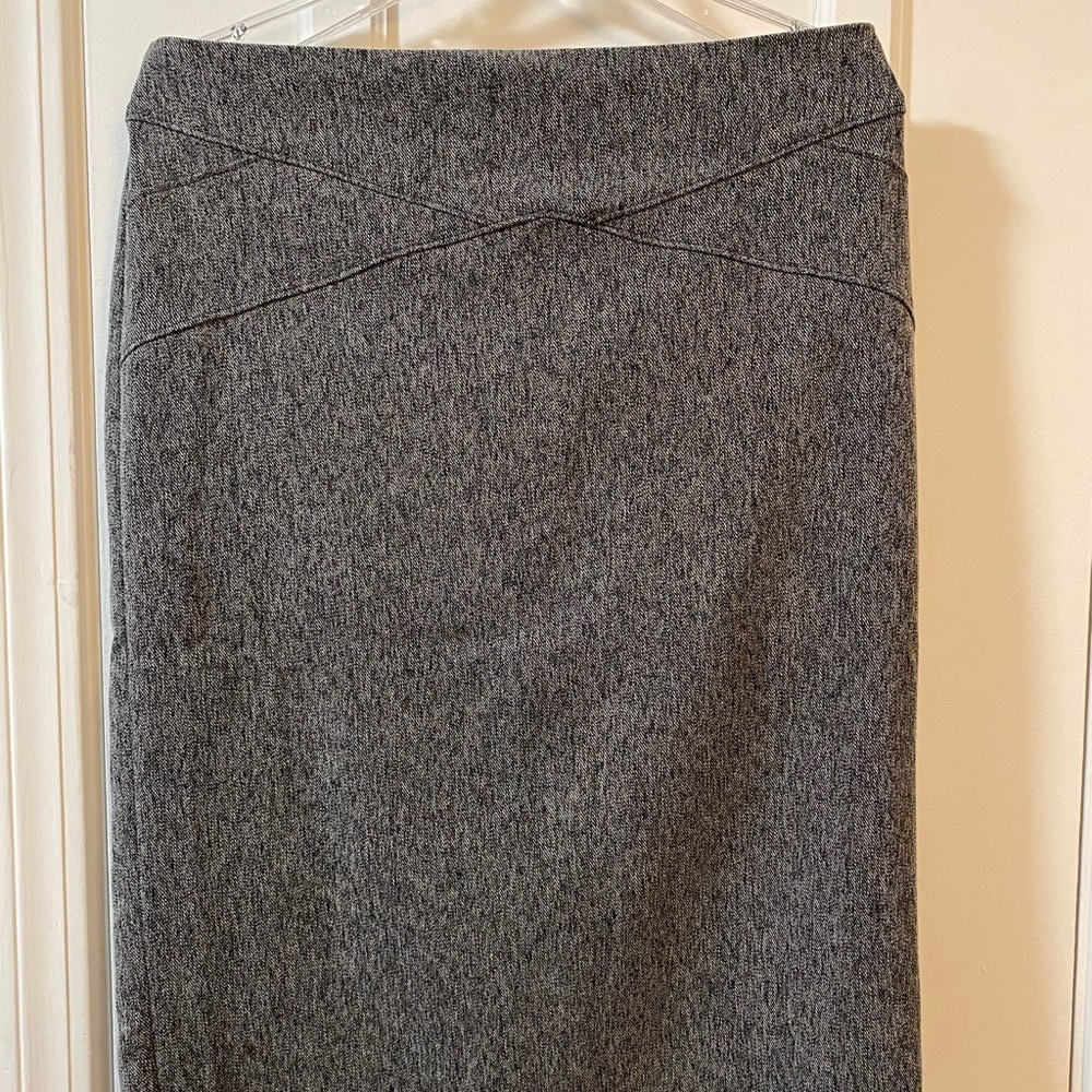 Grey tweed skirt hits below the knee